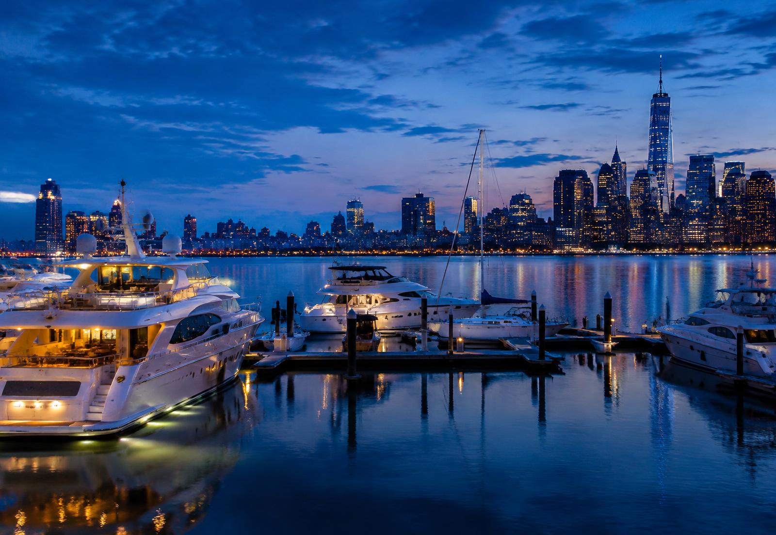 Yachts in a marina across the river from the Manhattan skyline